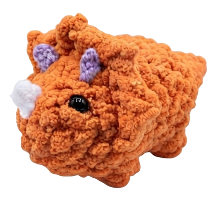 A medium-size orange triceratops plush