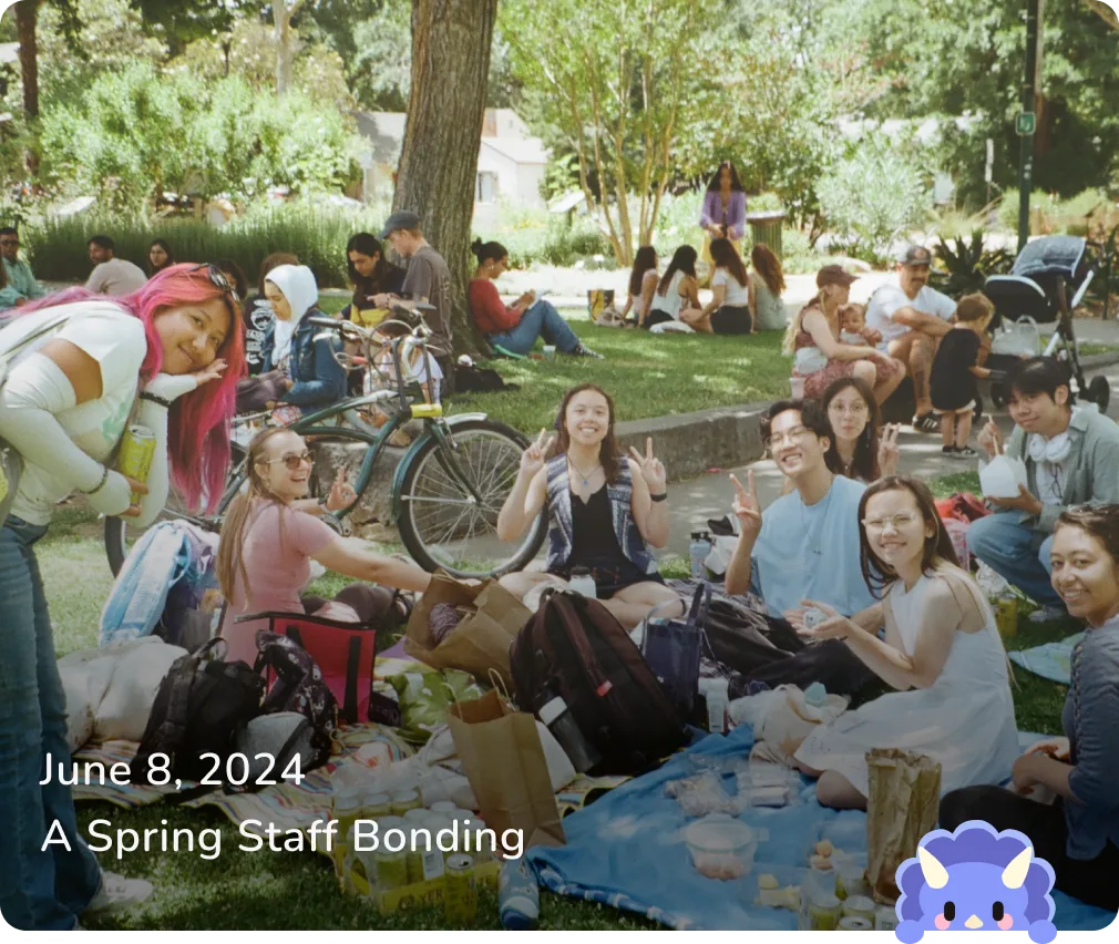 June 8, 2024 — A Spring Staff Bonding: staff sitting on picnic blankets in a park.